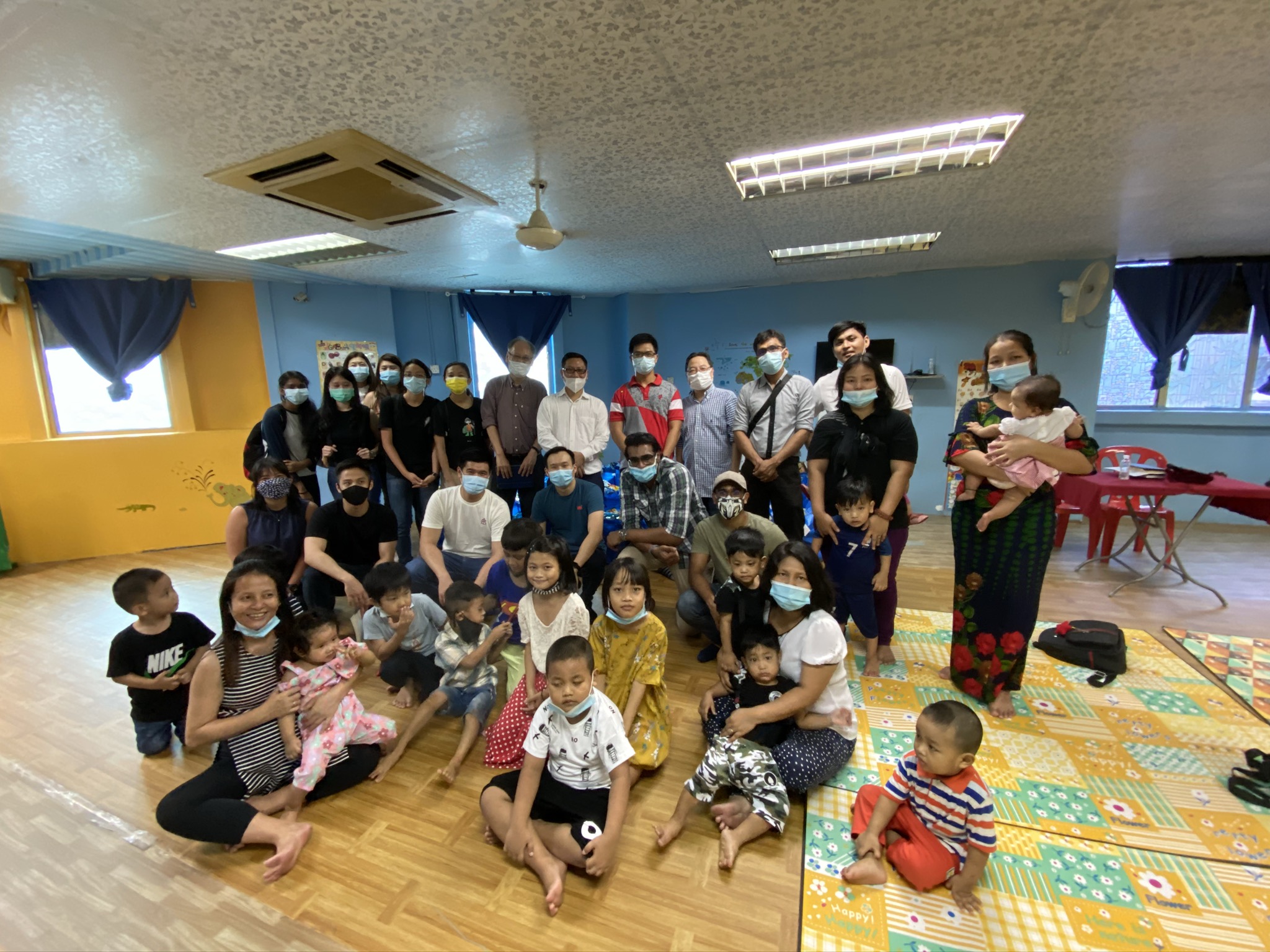 Group photo of the distribution team with the church members