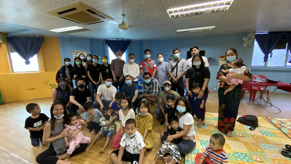 Group photo of the distribution team with the church members