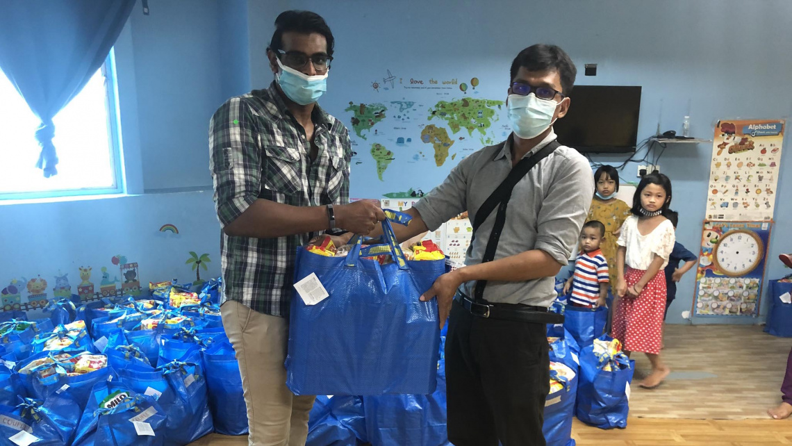 Project’s Young Adults Coordinator Eric Samuel distributing supplies to the church members